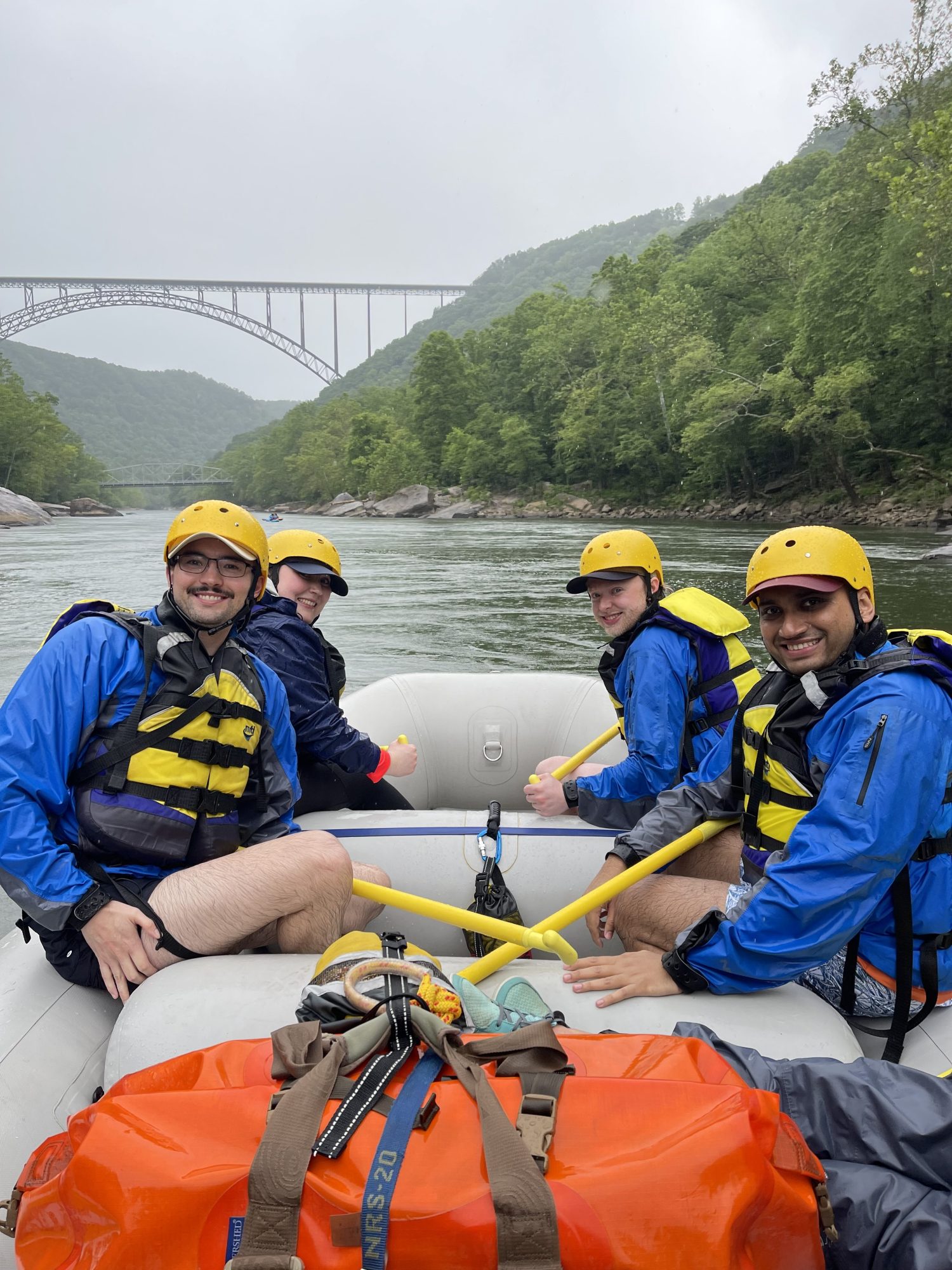 a group of people sitting on a raft