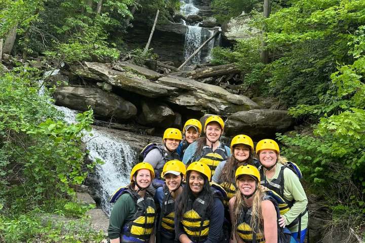 a group of people in a forest