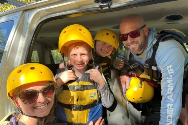 Anne Holm et al. in a car wearing a helmet