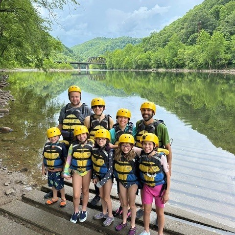 a group of people riding on the back of a boat