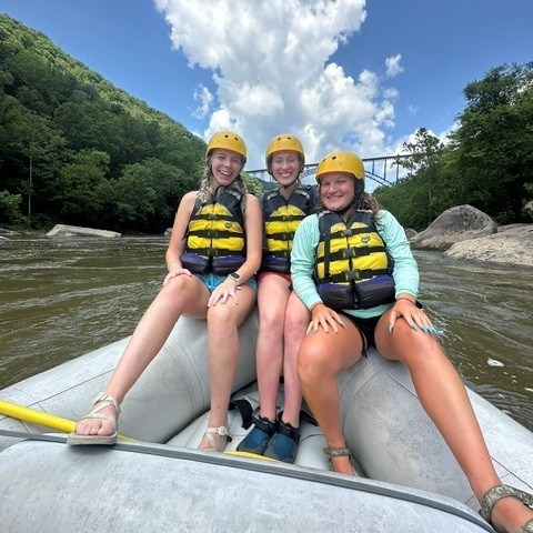 a group of people sitting on a boat